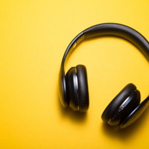 Image of a pair of headphones on a yellow background